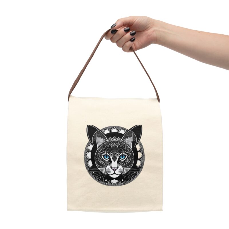 Easy to Carry Anywhere The Tribal Cat Lunch Bag comes with a convenient strap handle, making it easy to carry around wherever you go. Whether it's your daily commute, a field trip, or a picnic in the park, our lunch bag is your perfect companion. Perfect Size for All Occasions Measuring 12.5" x 8" x 5.5" (20.3cm x 31.8cm x 14cm), this bag is the ideal size for everything from quick snacks to three-course meals. Versatile and practical, it's suitable for both kids and adults, catering to all your lunchtime needs.