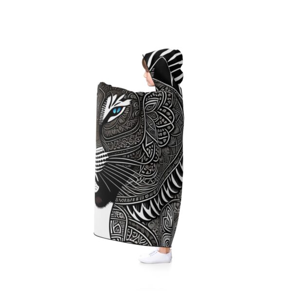 The vibrant Tibal Jaguar pattern adds a touch of excitement to your everyday routine, making it a unique and eye-catching fashion statement. Be the life of the party or campfire with this Hooded Shaman Blanket that will keep you warm and stylish all year round.