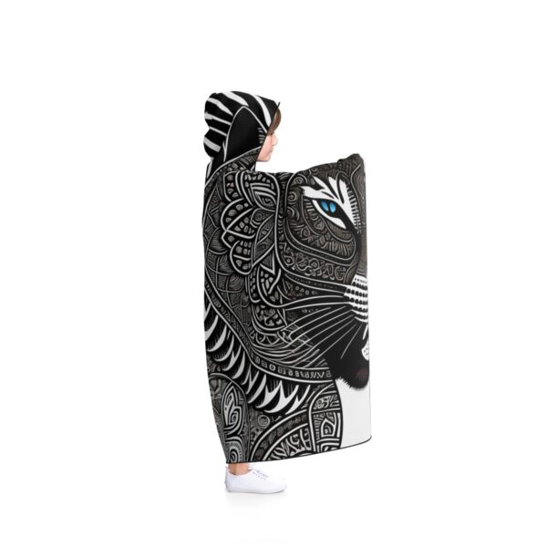 The vibrant Tibal Jaguar pattern adds a touch of excitement to your everyday routine, making it a unique and eye-catching fashion statement. Be the life of the party or campfire with this Hooded Shaman Blanket that will keep you warm and stylish all year round.